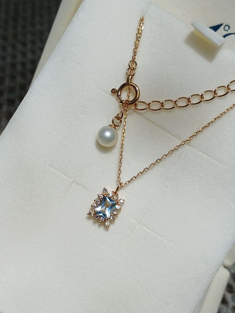 Moon Label necklace in 10K yellow gold featuring aquamarine, 0.07ct diamond, and 4mm Akoya pearl on a 43cm chain