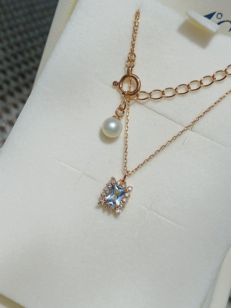 Moon Label necklace in 10K yellow gold featuring aquamarine, 0.07ct diamond, and 4mm Akoya pearl on a 43cm chain