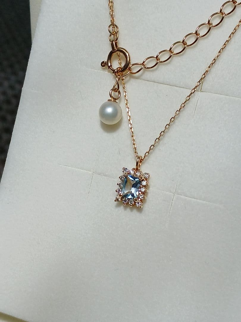 Moon Label necklace in 10K yellow gold featuring aquamarine, 0.07ct diamond, and 4mm Akoya pearl on a 43cm chain