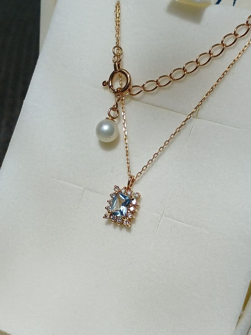 Moon Label necklace in 10K yellow gold featuring aquamarine, 0.07ct diamond, and 4mm Akoya pearl on a 43cm chain