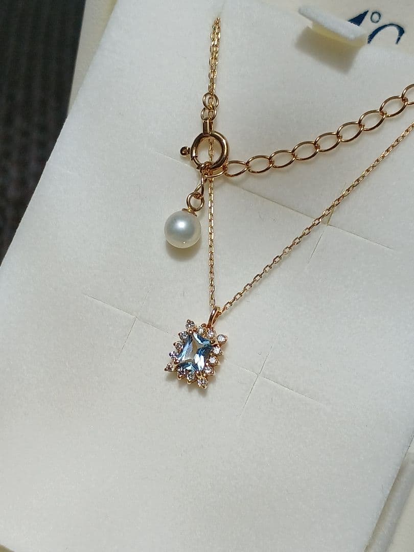 Moon Label necklace in 10K yellow gold featuring aquamarine, 0.07ct diamond, and 4mm Akoya pearl on a 43cm chain