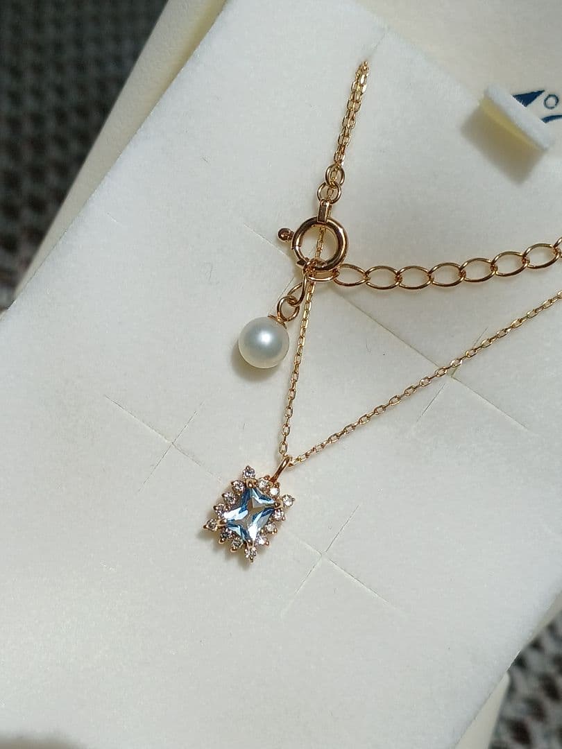 Moon Label necklace in 10K yellow gold featuring aquamarine, 0.07ct diamond, and 4mm Akoya pearl on a 43cm chain