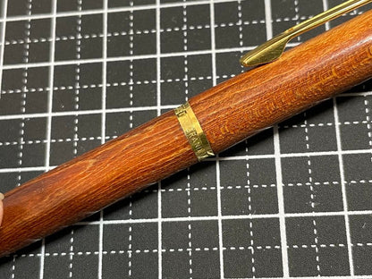 Pilot Grandee ballpoint pen with brown wooden body and gold metal accents