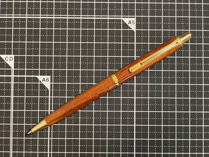 Pilot Grandee ballpoint pen with brown wooden body and gold metal accents