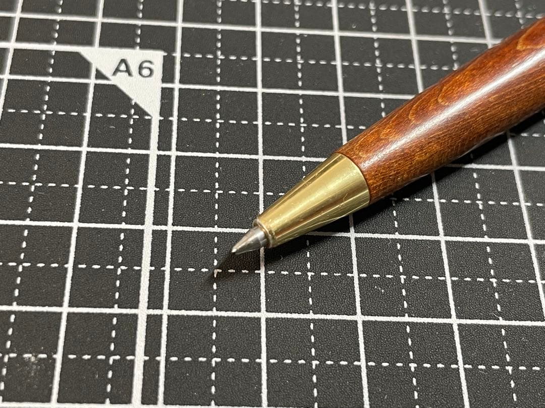 Pilot Grandee ballpoint pen with brown wooden body and gold metal accents