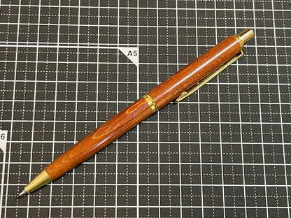 Pilot Grandee ballpoint pen with brown wooden body and gold metal accents