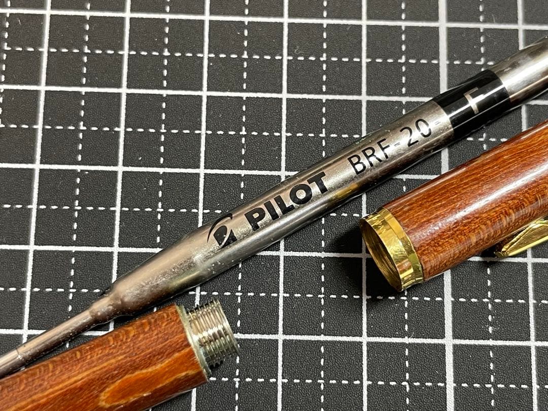 Pilot Grandee ballpoint pen with brown wooden body and gold metal accents