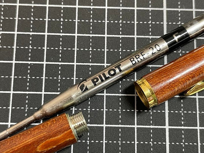 Pilot Grandee ballpoint pen with brown wooden body and gold metal accents