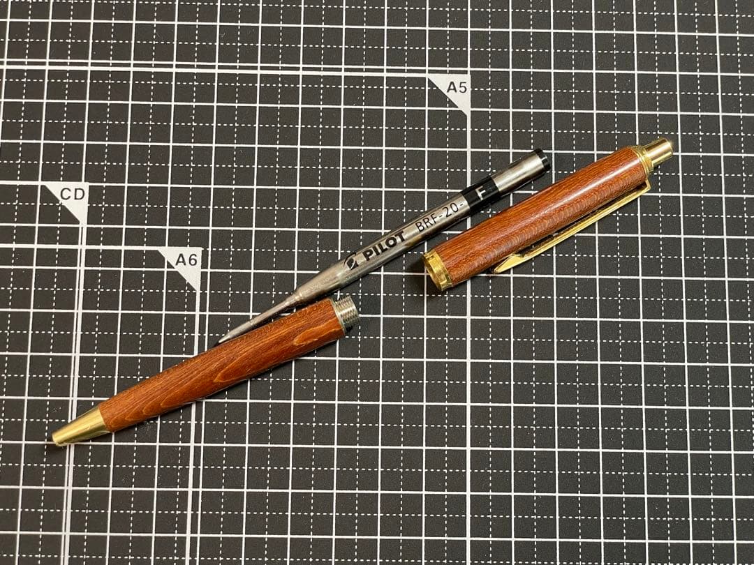 Pilot Grandee ballpoint pen with brown wooden body and gold metal accents