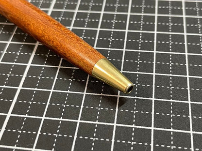 Pilot Grandee ballpoint pen with brown wooden body and gold metal accents