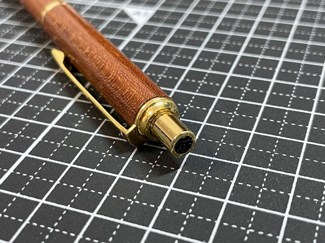 Pilot Grandee ballpoint pen with brown wooden body and gold metal accents