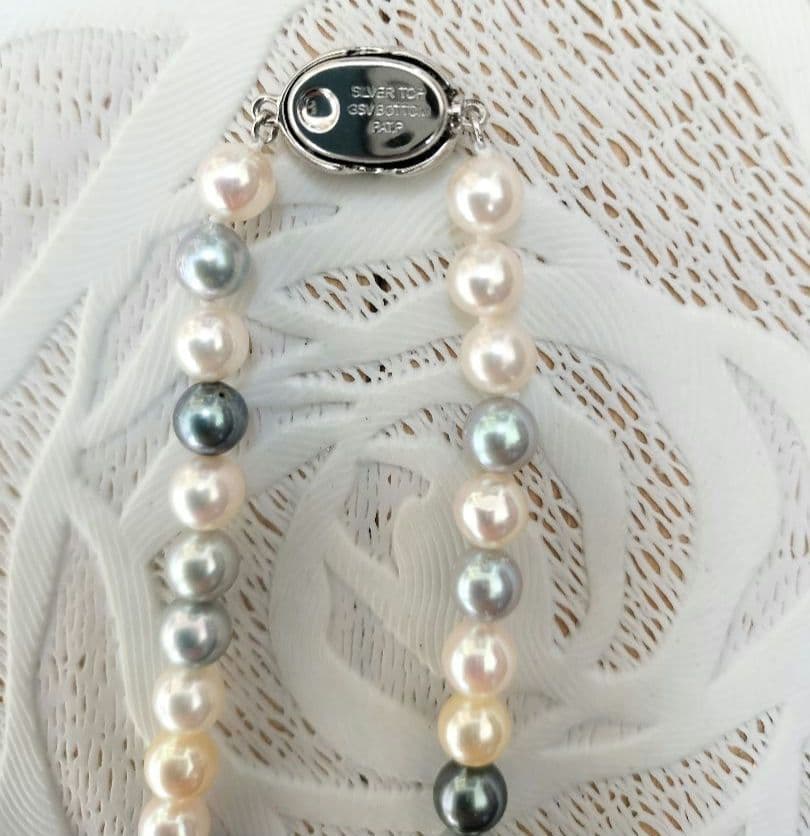 Akoya pearl necklace with 6mm round white, gold, green, and light gray pearls on a 42.5cm strand with silver push clasp