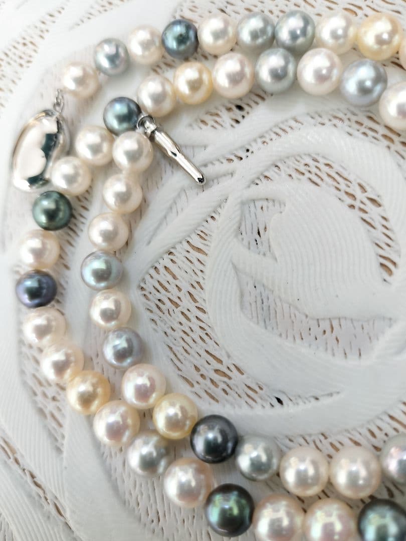 Akoya pearl necklace with 6mm round white, gold, green, and light gray pearls on a 42.5cm strand with silver push clasp