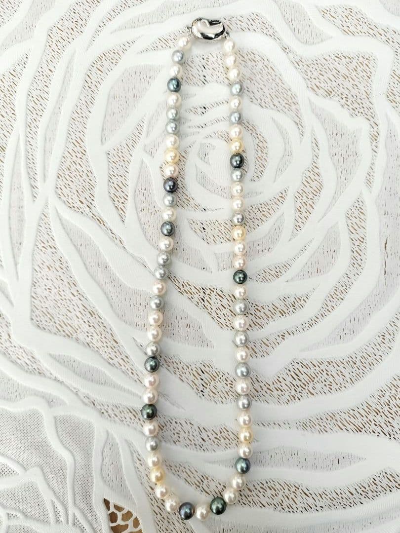 Akoya pearl necklace with 6mm round white, gold, green, and light gray pearls on a 42.5cm strand with silver push clasp