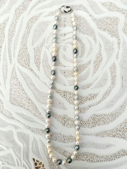 Akoya pearl necklace with 6mm round white, gold, green, and light gray pearls on a 42.5cm strand with silver push clasp