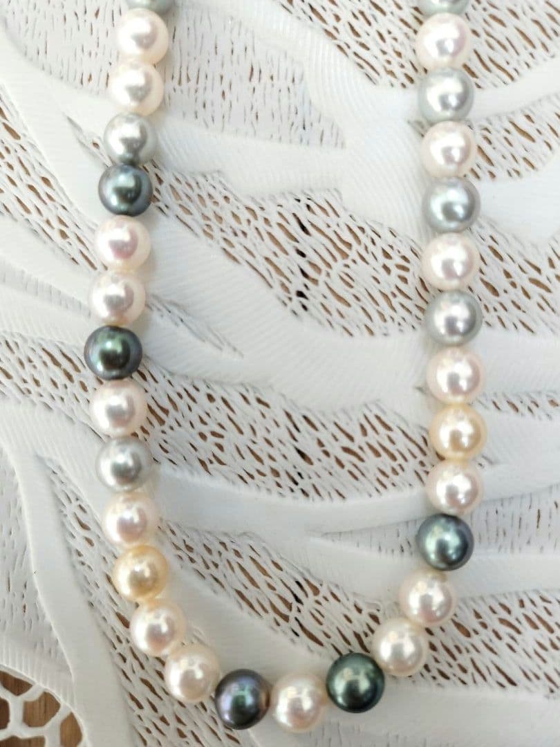 Akoya pearl necklace with 6mm round white, gold, green, and light gray pearls on a 42.5cm strand with silver push clasp