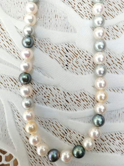 Akoya pearl necklace with 6mm round white, gold, green, and light gray pearls on a 42.5cm strand with silver push clasp