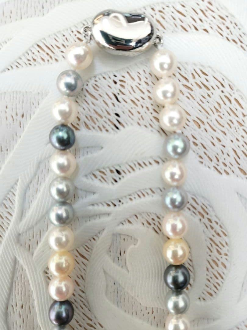 Akoya pearl necklace with 6mm round white, gold, green, and light gray pearls on a 42.5cm strand with silver push clasp
