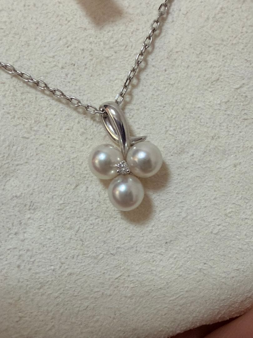 Mikimoto Akoya pearl and diamond necklace with three-strand design and floral motif on silver-colored metal chain