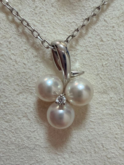 Mikimoto Akoya pearl and diamond necklace with three-strand design and floral motif on silver-colored metal chain