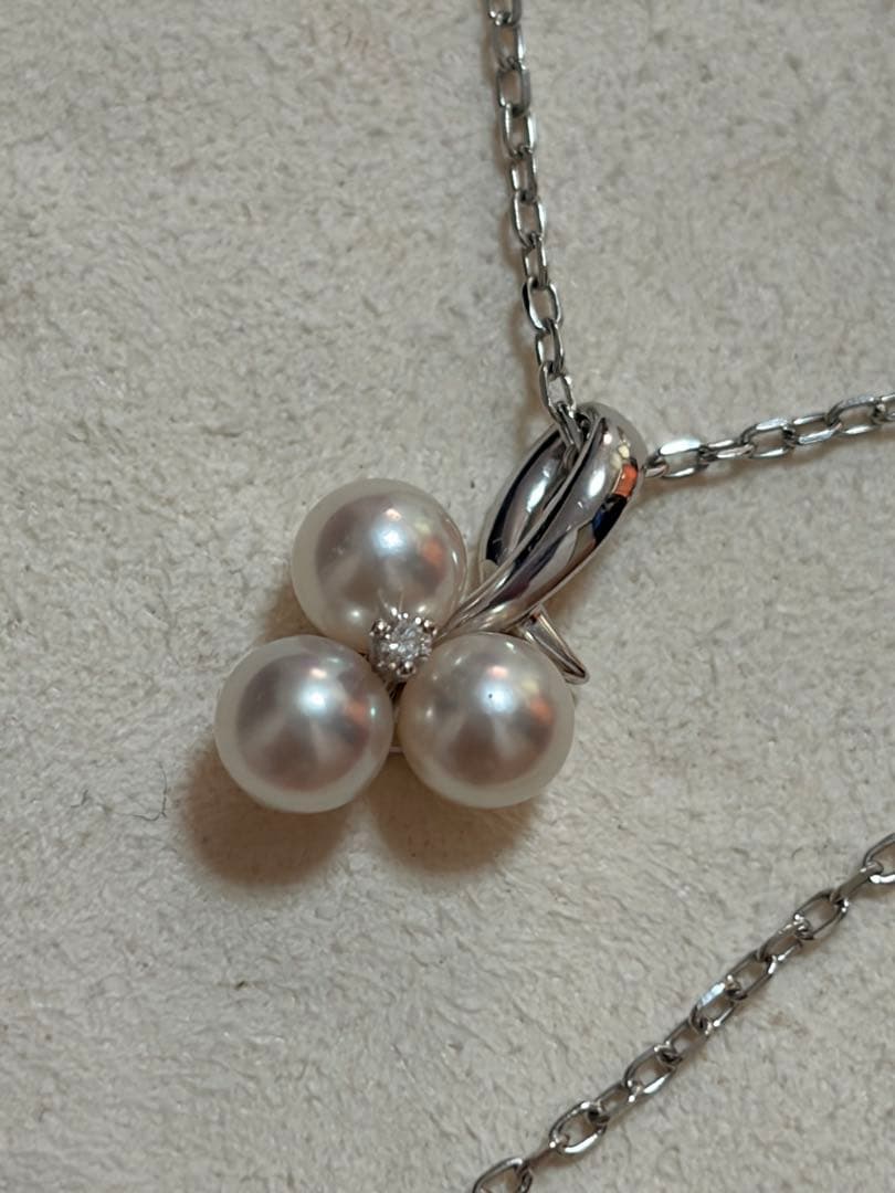 Mikimoto Akoya pearl and diamond necklace with three-strand design and floral motif on silver-colored metal chain