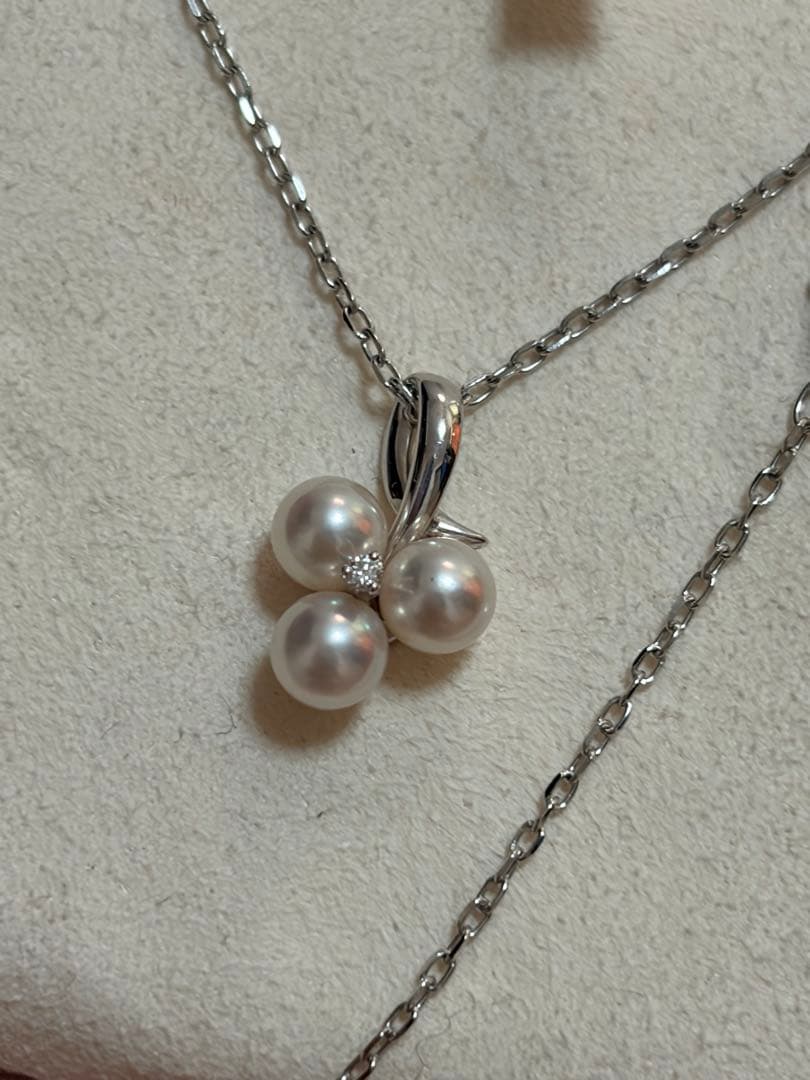 Mikimoto Akoya pearl and diamond necklace with three-strand design and floral motif on silver-colored metal chain