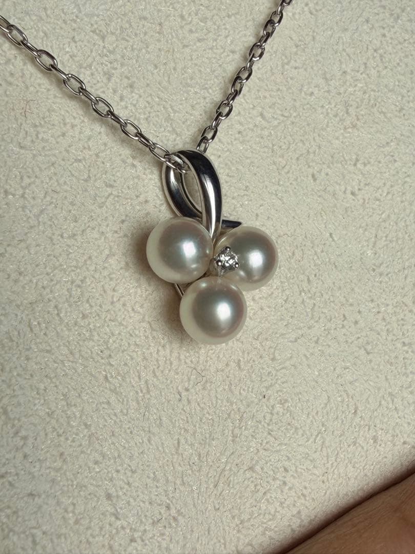 Mikimoto Akoya pearl and diamond necklace with three-strand design and floral motif on silver-colored metal chain