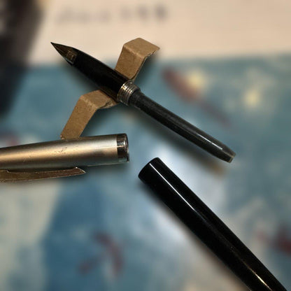 Pilot E-300 GU17 limited edition fountain pen with 14K gold coarse nib and black barrel shown writing characters