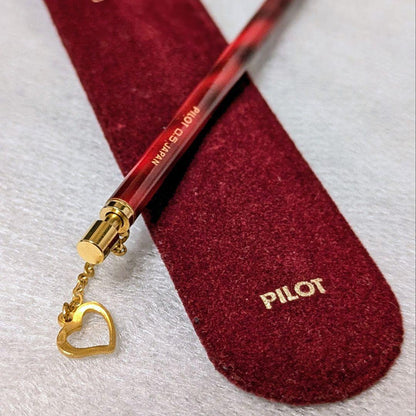 PILOT Mechanical Pencil in red tortoise marble pattern with gold accents and heart charm, displayed with velvet pen case and cloth box