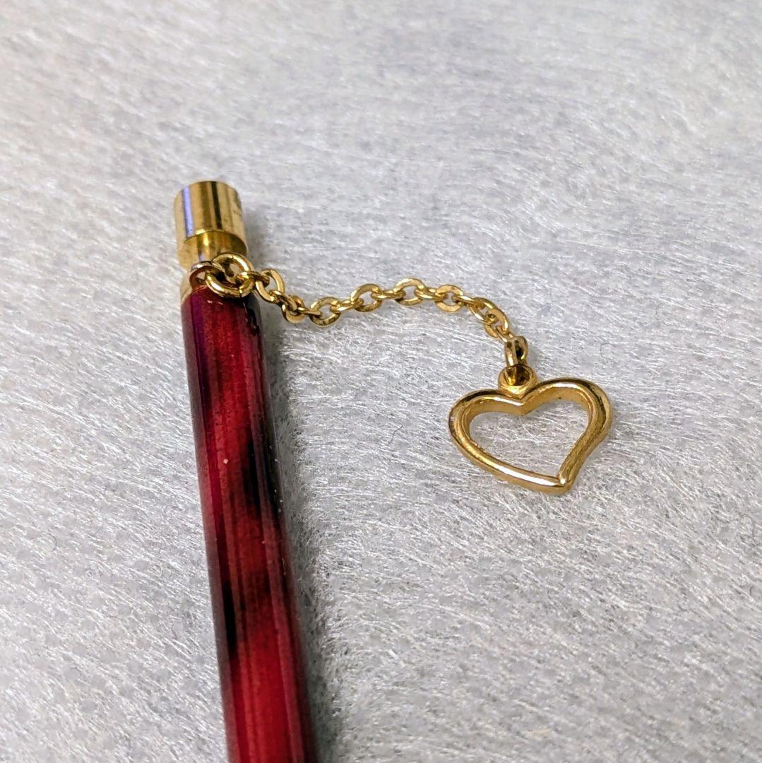 PILOT Mechanical Pencil in red tortoise marble pattern with gold accents and heart charm, displayed with velvet pen case and cloth box