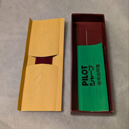 PILOT Mechanical Pencil in red tortoise marble pattern with gold accents and heart charm, displayed with velvet pen case and cloth box