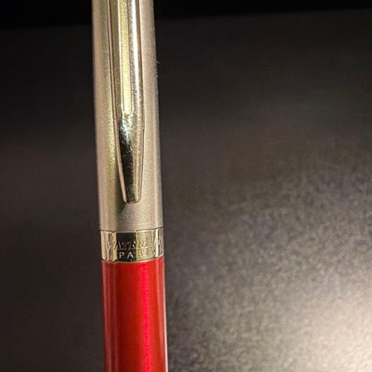 Blue ballpoint pen with smooth ink tip and ergonomic grip on white background