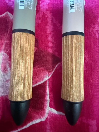 Set of four multi-color ballpoint pens, some featuring mechanical pencil function