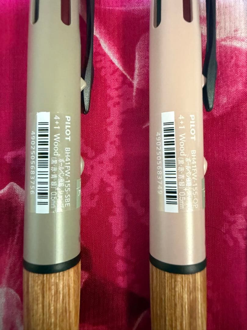 Set of four multi-color ballpoint pens, some featuring mechanical pencil function
