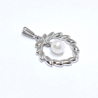 Mikimoto Pearl Necklace Top Leaf made of silver with pearl accent, delicate and elegant design