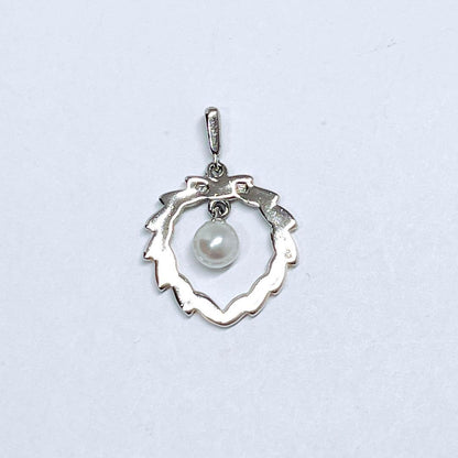Mikimoto Pearl Necklace Top Leaf made of silver with pearl accent, delicate and elegant design