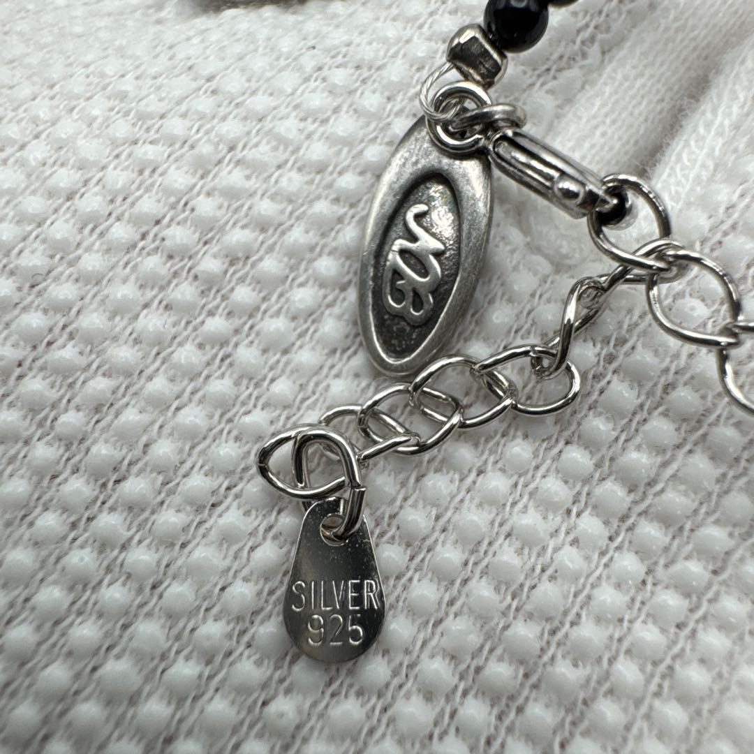 Mikimoto M Mark genuine pearl pendant with thin black coral silver bead necklace on white background