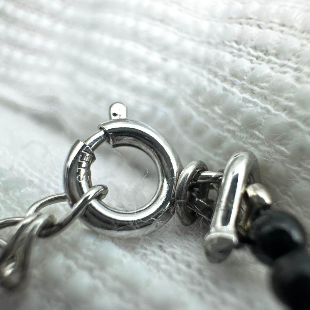 Mikimoto M Mark genuine pearl pendant with thin black coral silver bead necklace on white background