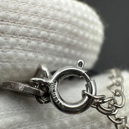 Mikimoto M Mark genuine pearl pendant with thin black coral silver bead necklace on white background