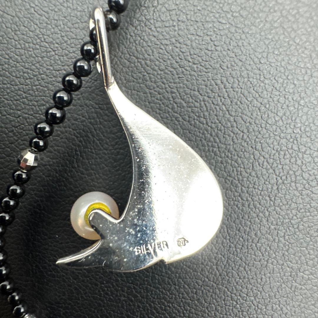 Mikimoto M Mark genuine pearl pendant with thin black coral silver bead necklace on white background