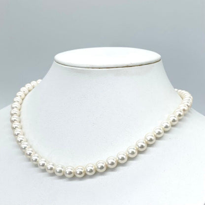 Akoya first-class pearl necklace with 7 to 7.5mm pearls and silver clasp on a white background