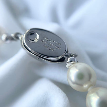 Akoya first-class pearl necklace with 7 to 7.5mm pearls and silver clasp on a white background