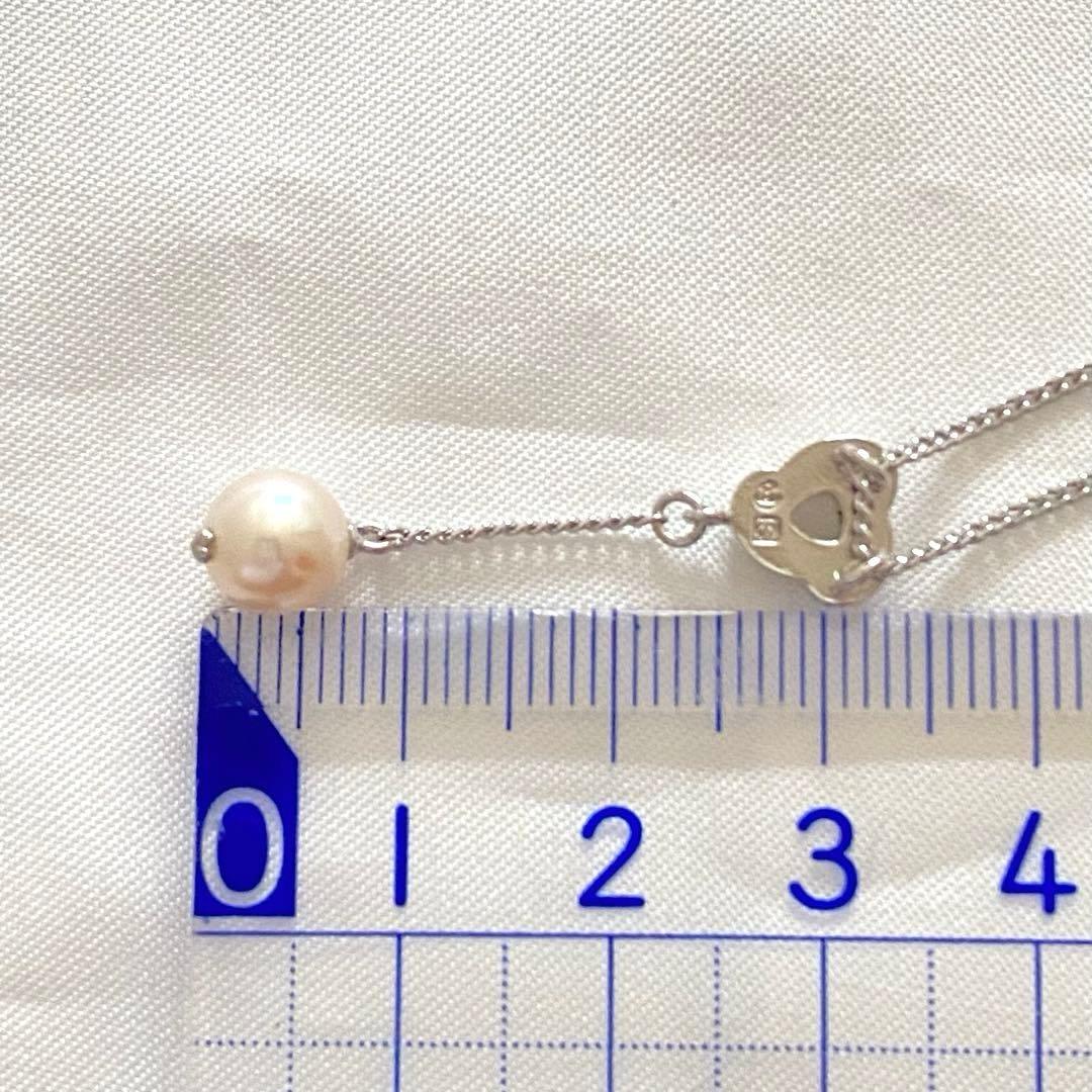 Silver Tasaki x Noevnir single pearl necklace with simple design on a white background