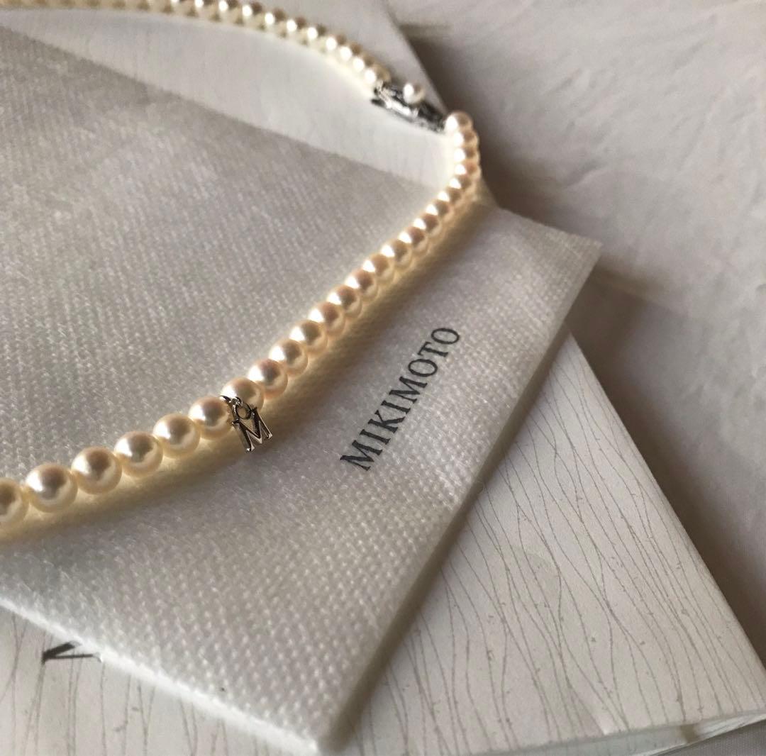 Mikimoto pearl necklace with M charm in white gold featuring 5.5-5.9mm pearls and pouch