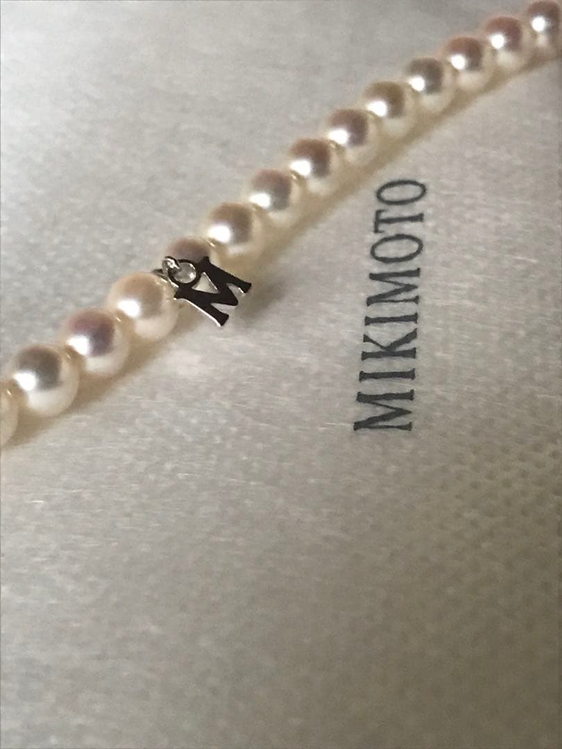 Mikimoto pearl necklace with M charm in white gold featuring 5.5-5.9mm pearls and pouch