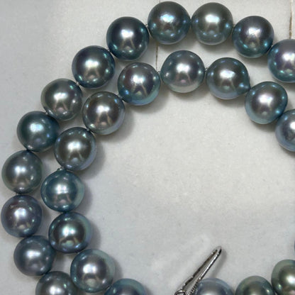 Tasaki Akoya pearl necklace with 9.7mm pearls, 46g weight, and 43cm sterling silver chain