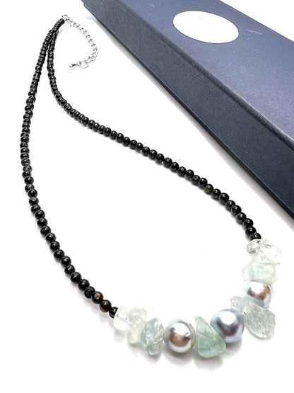 Akoya pearl necklace with natural blue pearls, aquamarine stones, and black tourmaline on a 42 to 47 cm chain