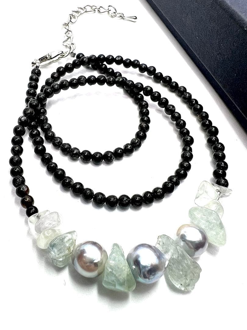 Akoya pearl necklace with natural blue pearls, aquamarine stones, and black tourmaline on a 42 to 47 cm chain