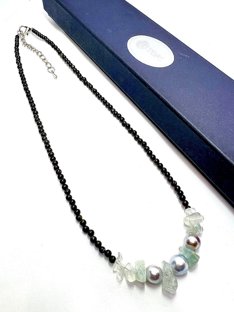 Akoya pearl necklace with natural blue pearls, aquamarine stones, and black tourmaline on a 42 to 47 cm chain