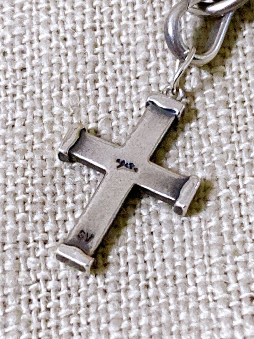 Agete Silver 925 bracelet featuring a cross motif and a pendant top on a white background